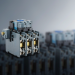 AC magnetic contactor product photograph with rows of contactors on DIN rail in an industrial control panel