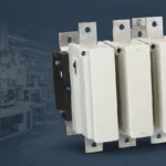 Vetting AC contactor suppliers: factory production line background with contactor product as hero