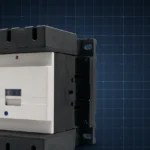 CJX2-D170 industrial AC contactor with dramatic lighting on a dark navy blueprint grid background