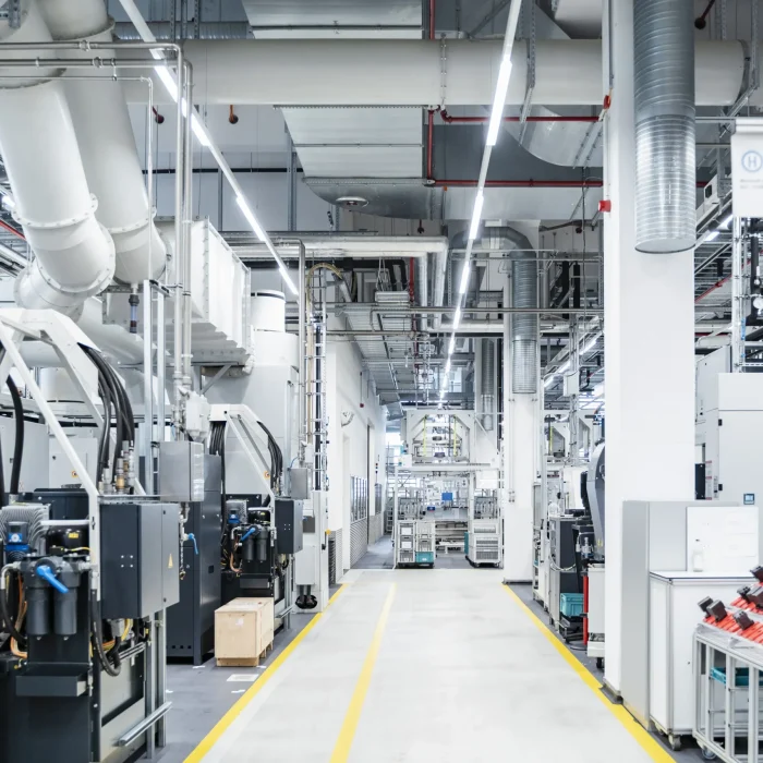 pipes-and-air-duct-over-footpath-in-modern-factory-2024-09-18-10-12-45-utc